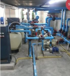 Detailed industrial plumbing design layout with high-pressure blue piping and automated pump systems.